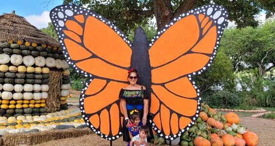 mother and kids in Dallas Arboretum Pumpkin Village One of the monthly events in Dallas