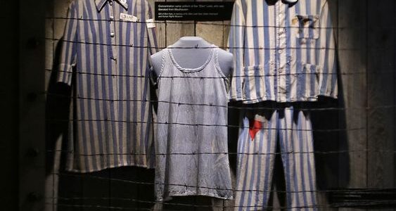 picture of clothes worn by prisoners in display, Exploring the History of Dallas: