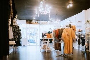 interior view of a shop with Halloween costumes and decoration.