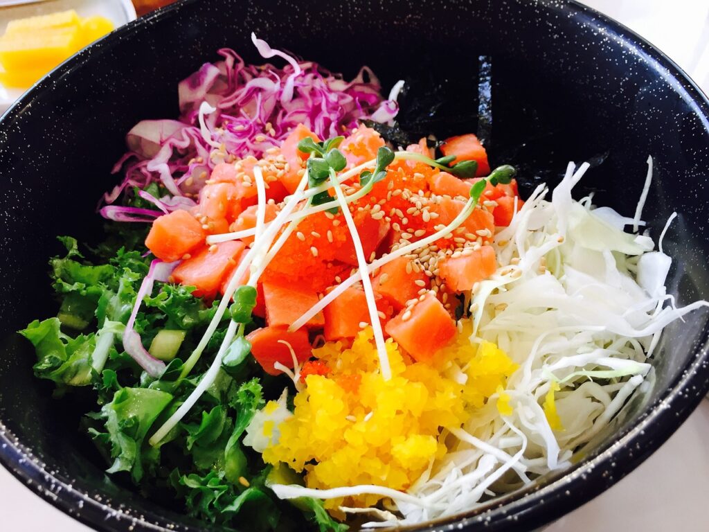 Hamachi Nabe – yellowtail sashimi, soy broth, and fish roe served with rice.