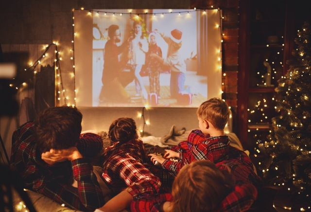 Family members watching movie Thanksgiving and Christmas traditions