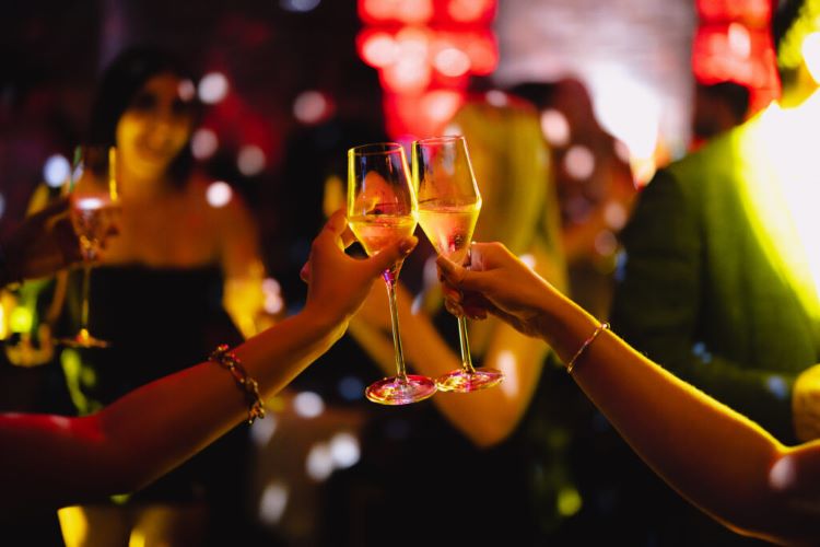 people enjoying a sparkling midnight Champagne toast,