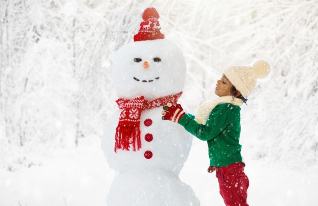 A child making snowman for Christmas, one of the activity from the Dallas winter bucket.