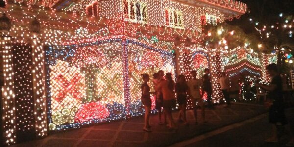 people-standing-by-illuminated-house-christmas-night_tex-mex dallas, Magical things to do in Dallas this December