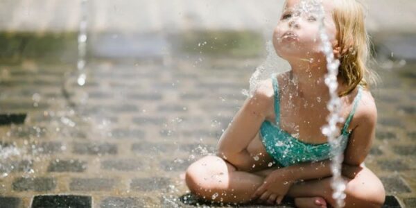 girl squishing water from her mouth, Top Water Park Dallas